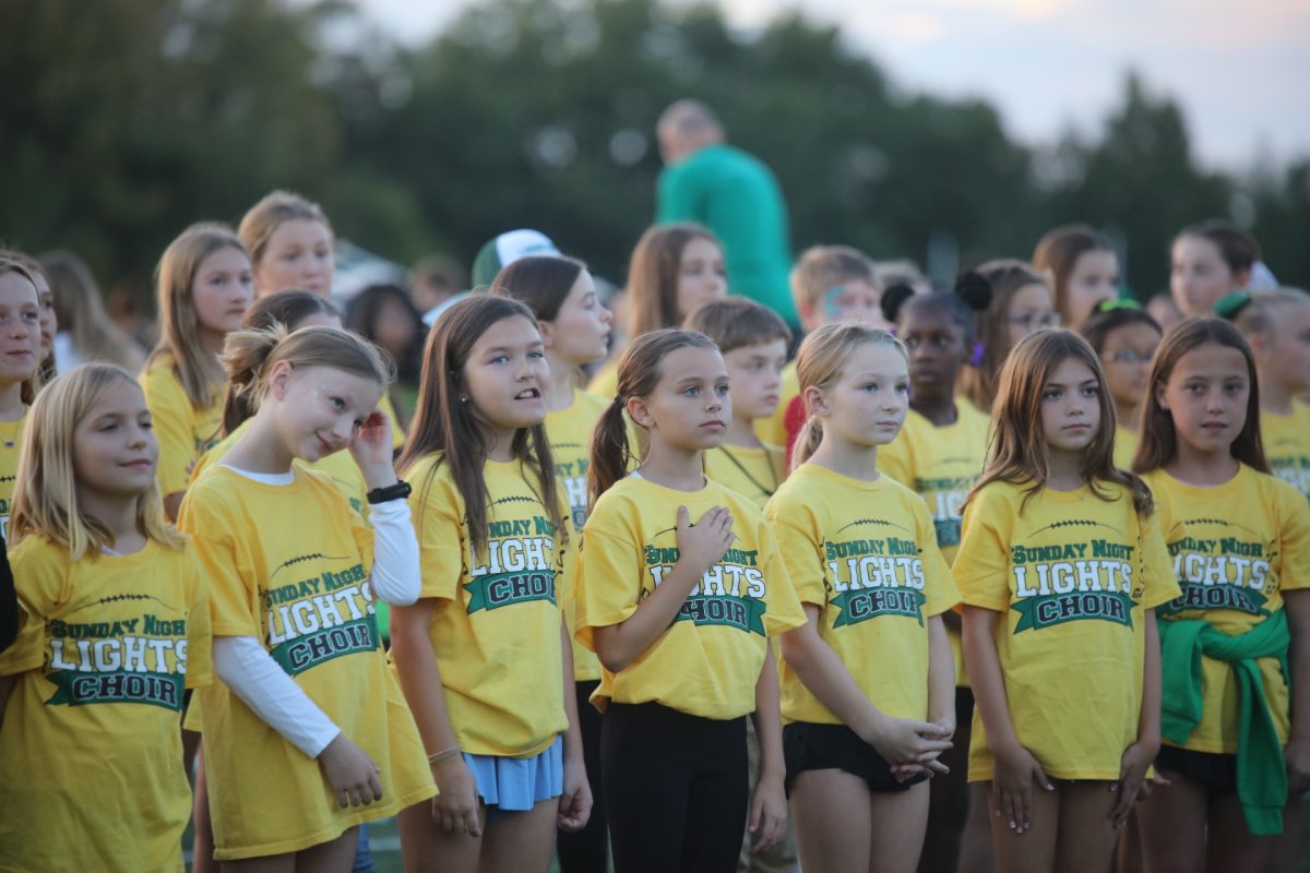 The Sunday Night Lights Choir sang the National Anthem before the start of the flag football game.