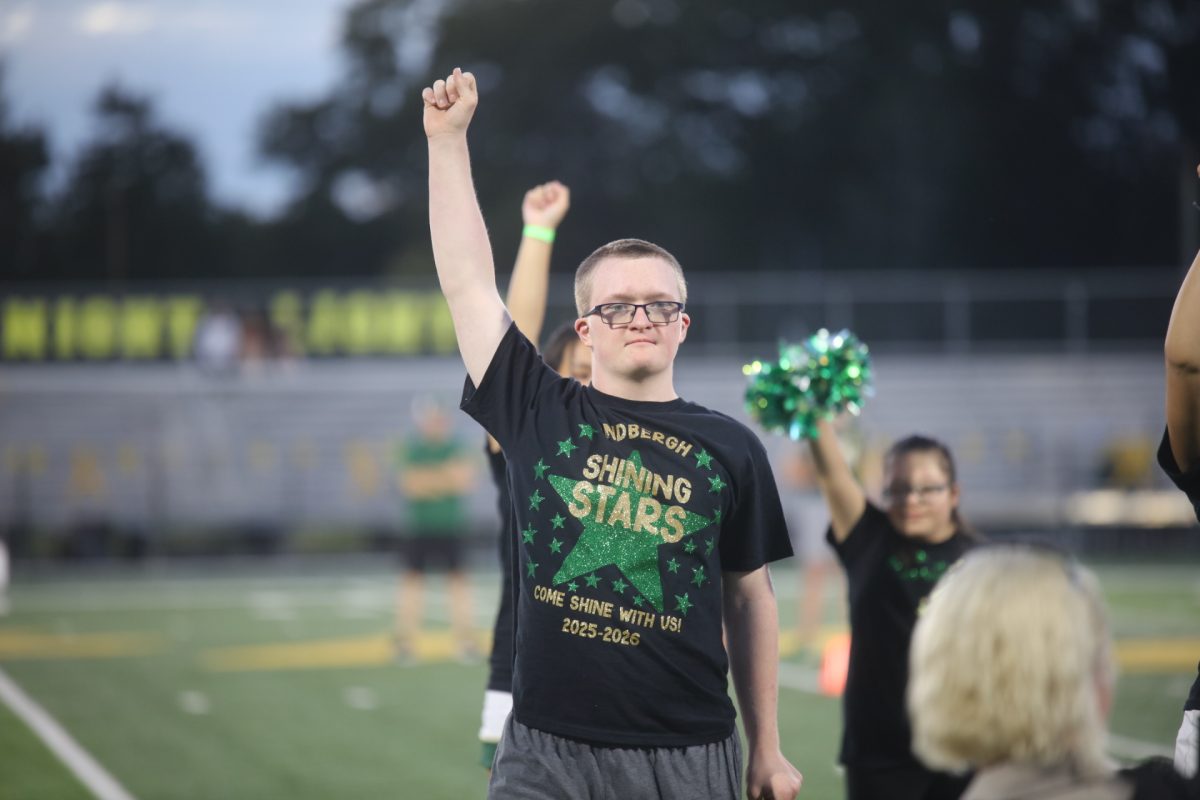 A student strikes a pose at the close of the Shining Stars dance team Halloween-themed dance. 