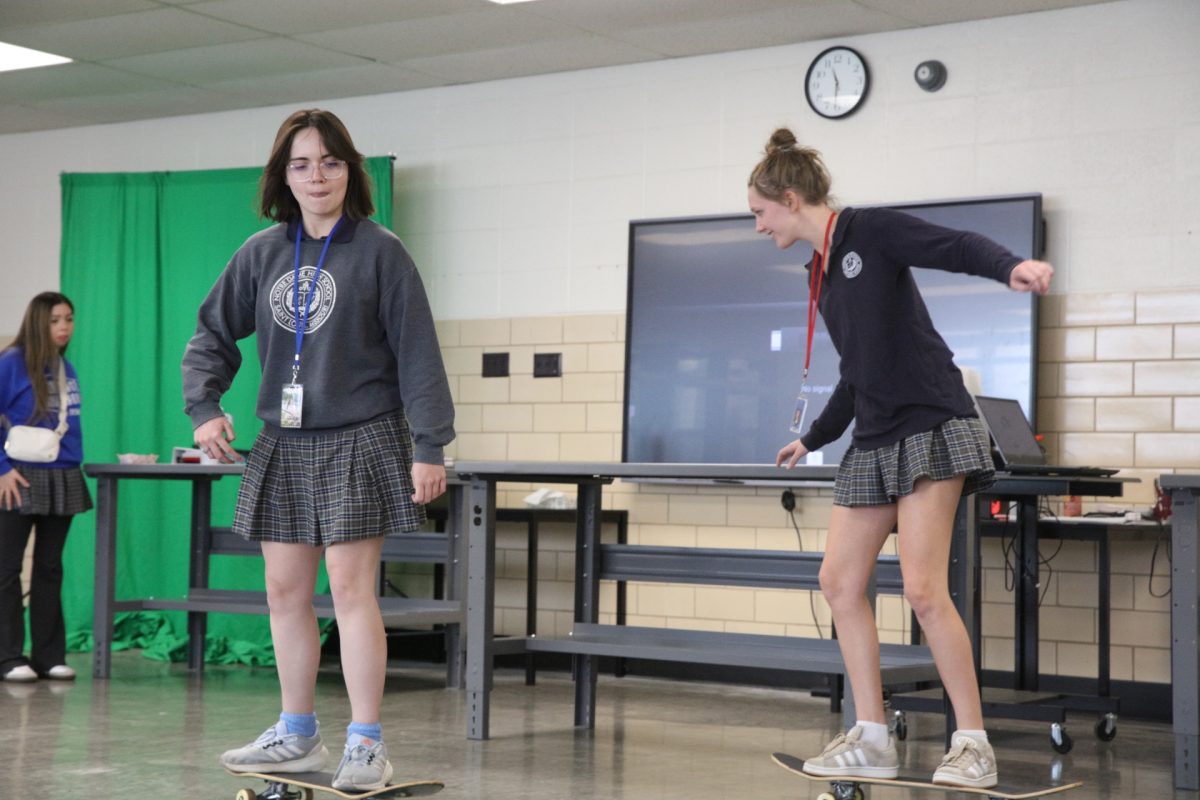 Lenora Holmstrom and Cameron Thierauf concentrate to balance.