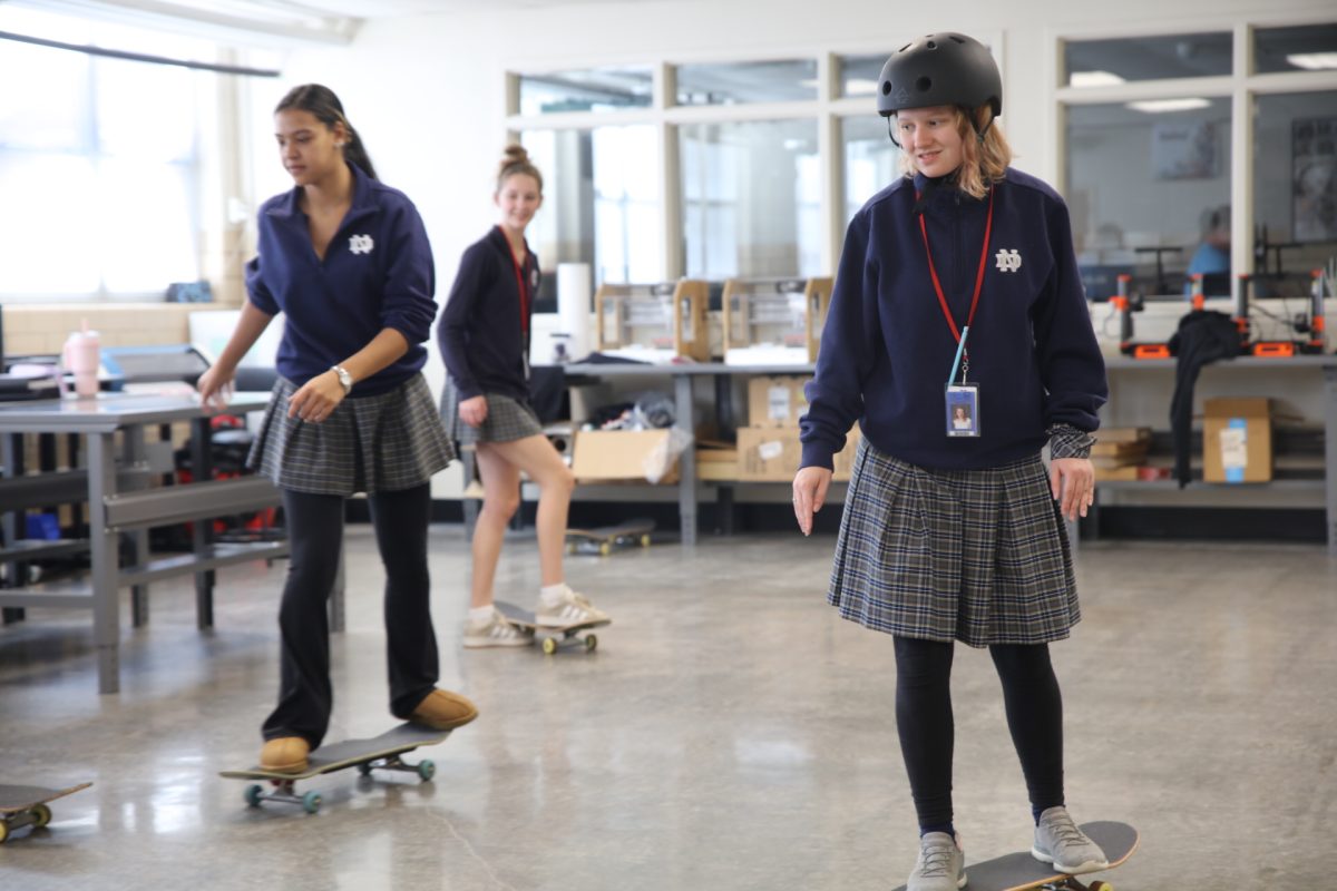 After finding her footing, Eileen Simoncic attempts to move forward on her skateboard.