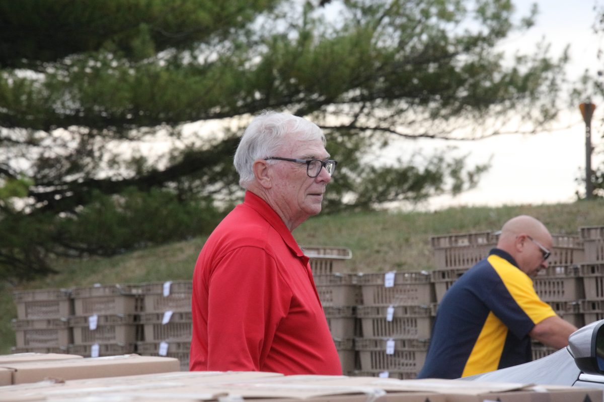 Rep. Jim Murphy directed traffic and said hello to those who came to the drive-through food distribution event.