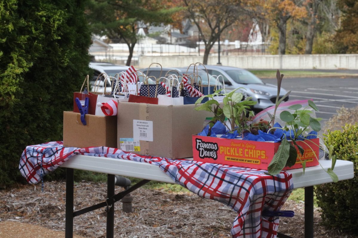 At the Veteran's Day ceremony, plants and flags were passed out as favors to attendees.
