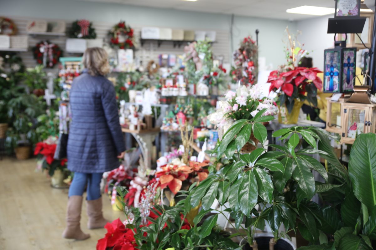 Shoppers at Irene's Floral Design peruse plants, participating in the annual Oakville Community Holiday Crawl held this year on Dec. 6.