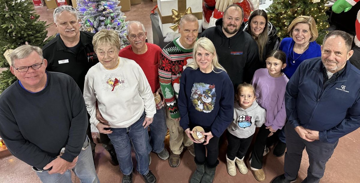The 2025 Outdoor Decorating Contest Winners. From left to right: Jeff Stegman; Tom Turner (Handyman Hardware manager); Jerry and Wilma Davidson; Eric, Kelly, Emily and Hayley Glossmeyer; Steve George and Erin O’Donnell; Sue Middendorf and Dennis Hayden (from Coldwell Banker Real Estate).