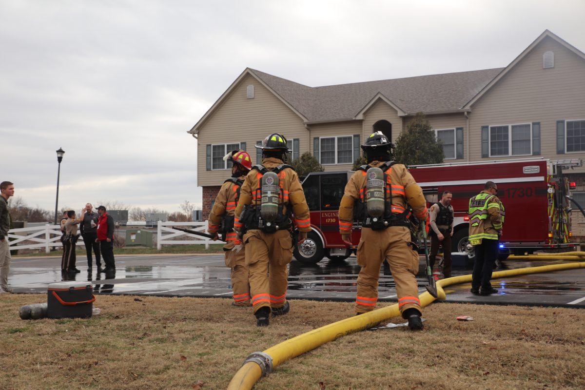 Firefighters arrive on-scene at the Arthur Commons condominiums.