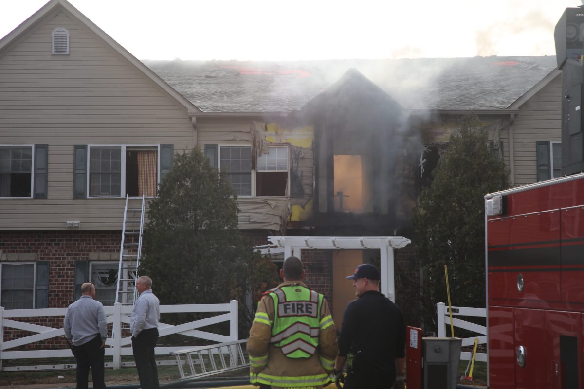 Smoke pours from the burnt condominiums.