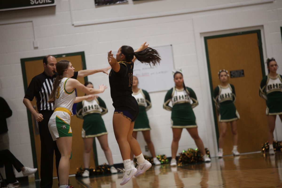 An Affton player jumps in front of Bayless senior Skylar Sleik in an attempt to block her throw-in.
