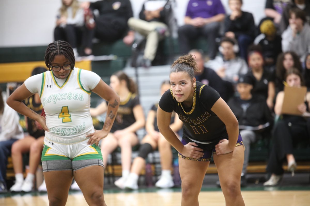Affton High School junior Phoenix Clark, right, waits for a member of the opposing team, Bayless, to take a free throw. 