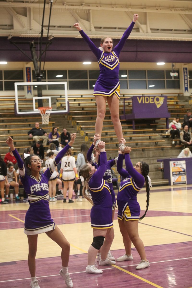 Affton's cheerleaders keep up team morale despite the game's score.