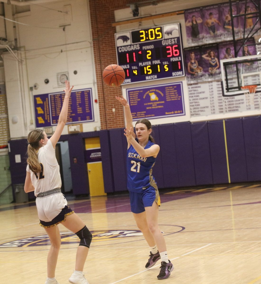 Affton senior Lillian Hutchison reaches up in an attempt to block a shot by Seckman's Rainey Slavens.