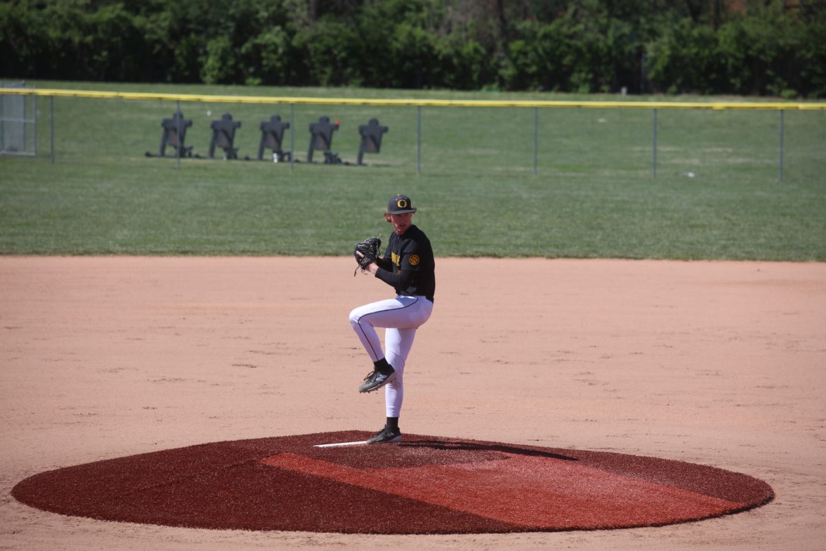 The pitcher for the Oakville Tigers prepares to pitch to the batter on April 6.