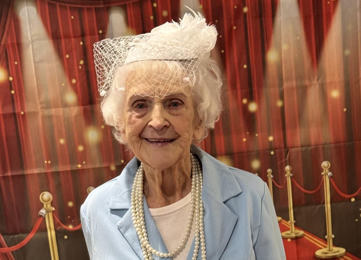 Betty Mueller, a resident of Cedarhurst of Tesson Heights, poses in her prom outfit at the event.