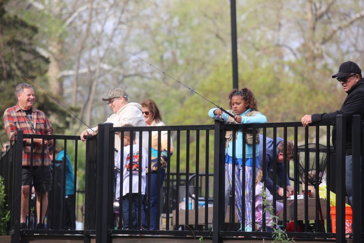 Children and their families cast their lines from the deck overlooking the Whitecliff Quarry during Crestwood's fishing derby on April 11.