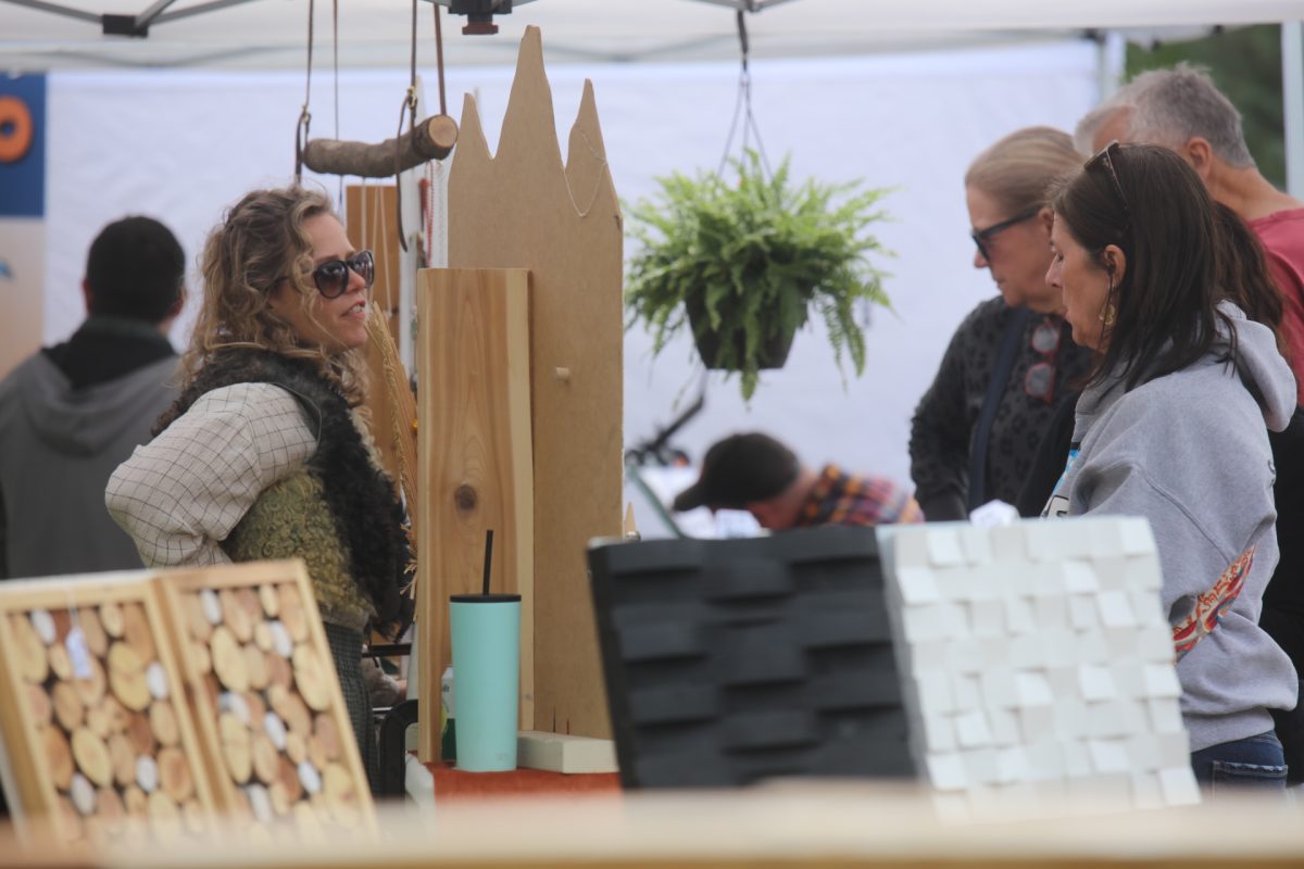 A vendor talks to attendees at the Sunset Hills Makers Market on May 2.