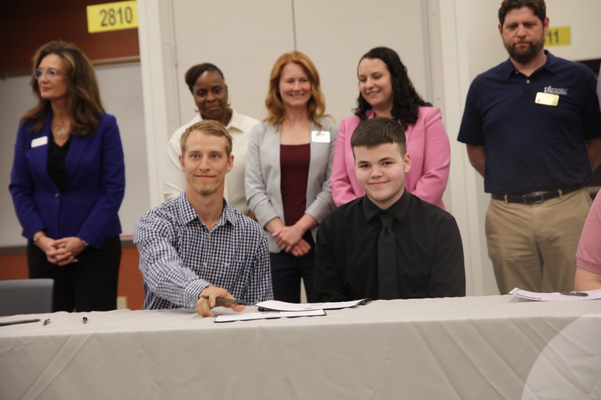 Caden Sullivan (right), a student at both Lindbergh High School and South Tech, will apprentice as a Industrial Manufacturing Technician for Natoli.