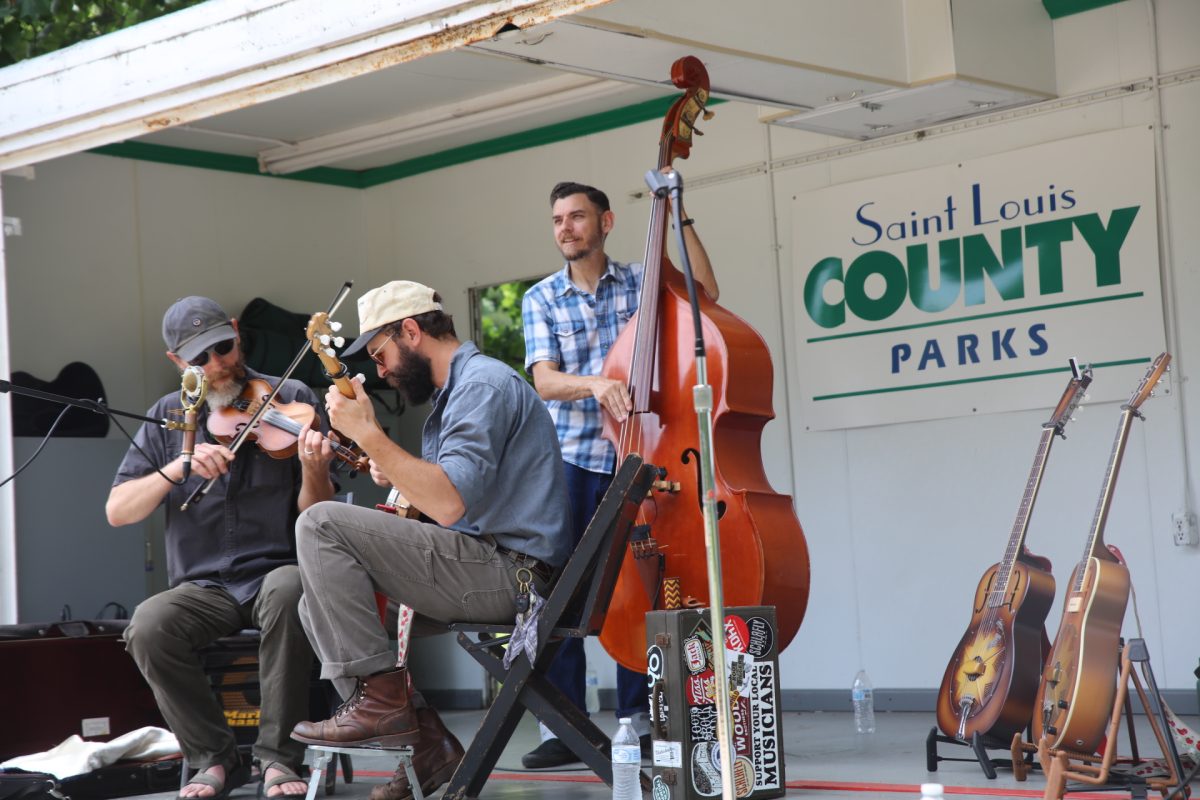 The Dust Covers — a St. Louis based acoustic trio specializing in traditional old time, early blues and roots music — perform at the 2026 St. Louis Area
History Showcase held in Jefferson Barracks Park on June 6.