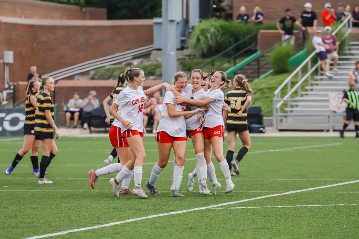 The Cor Jesu Academy soccer team celebrates at the state championship tournament. Photo by Olivia Strubhart.