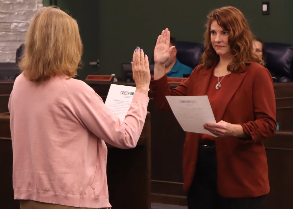 Ward 2 Alderperson Kitty Nangle Lohrum is sworn into office by city clerk Helen Ingold. Photo courtesy of AJ McNaughton.