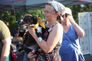 A “Pet Palooza” attendee meets an adoptable puppy from Gateway Pet Guardians.