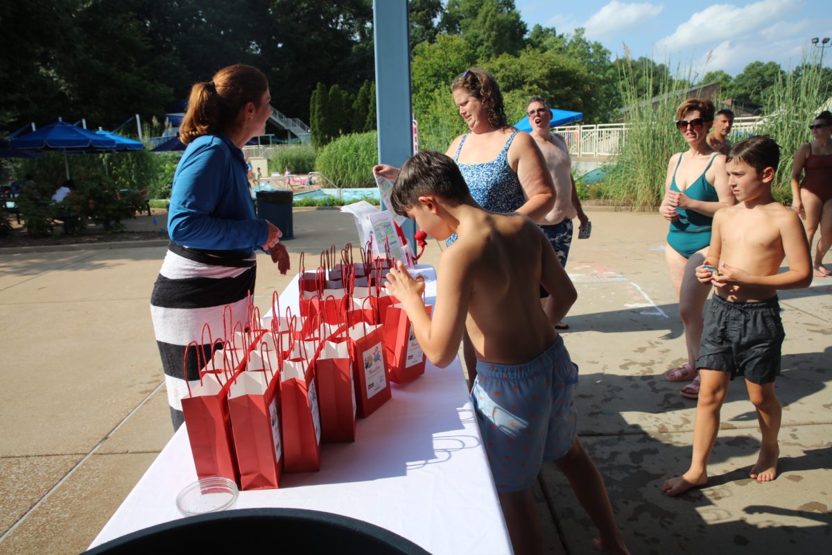 Those who brought in and donated five or more food items were offered a children’s goodie bag. Pictured above, an attendee reaches for a bag.