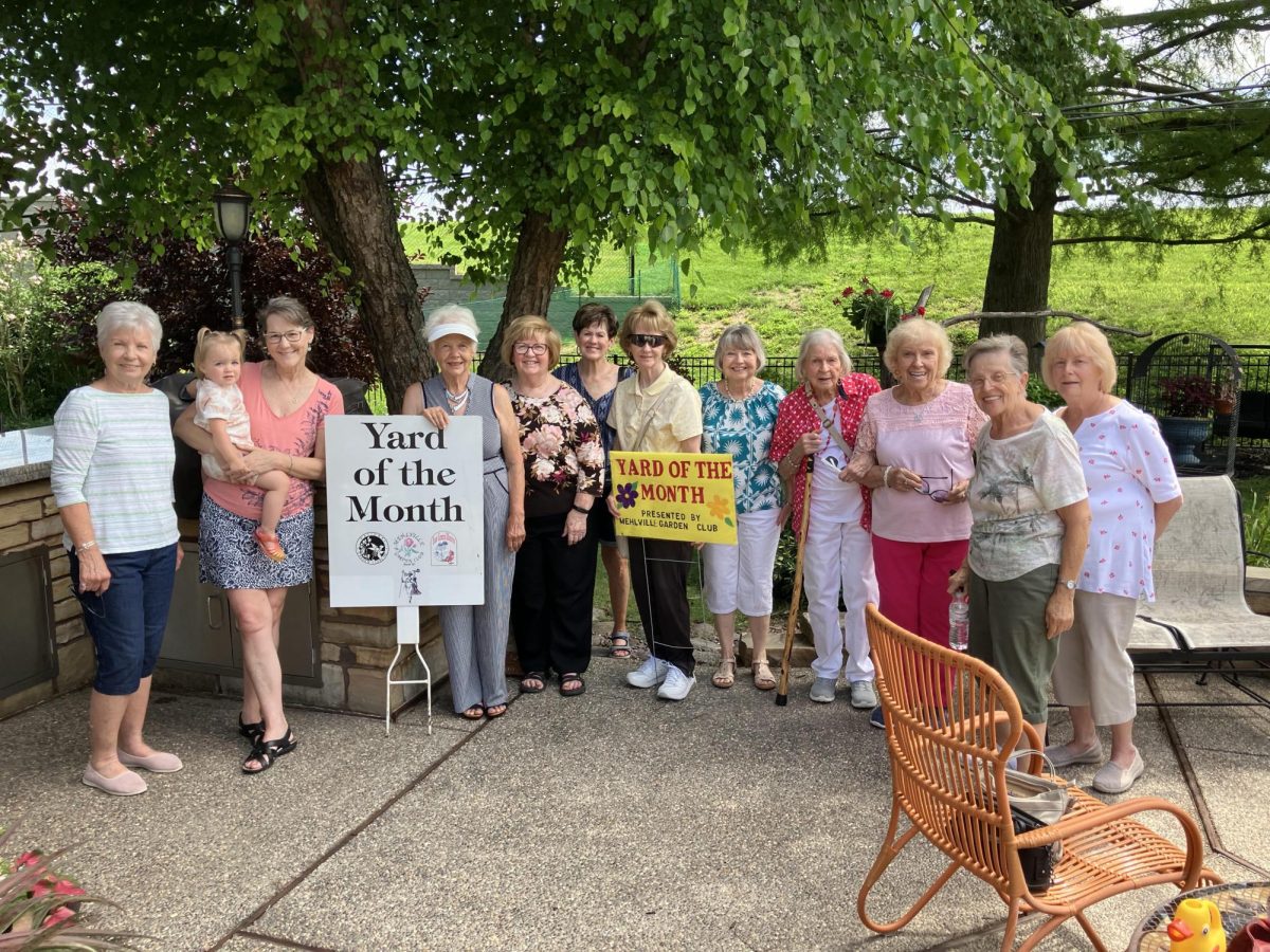 Pictured above, members of the Mehlville Garden Club present the Yard of the Month sign for June 2026. Those pictured include: Marilyn Lammering, Sandy Kerbeck and her granddaughter, Laura Kump, Christine Linneback, Betty Fresta, Lois Floro, Colleen O’Brien, Ruby Scheneppe, Dol Gormley, Annemarie Bertich and Kathy Sanders. Photo courtesy of Marilyn Lammering.
