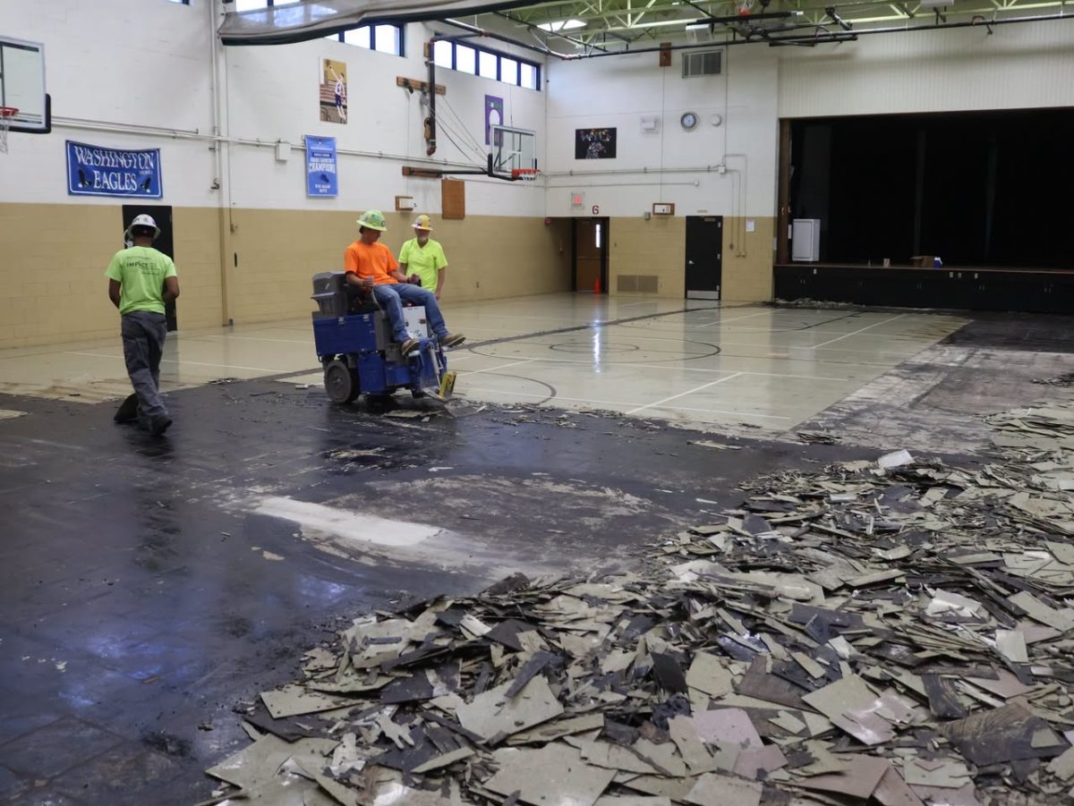A crew works to renovate the gym floor at Washington Middle School. Photo courtesy of the Mehlville School District.