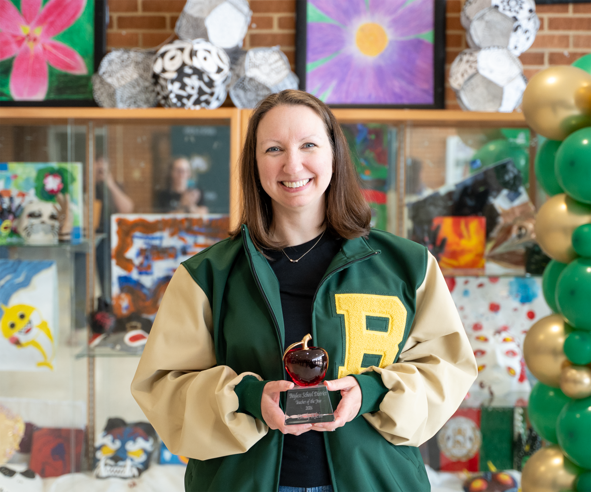 Emily Klein poses with her Bayless Teacher of the Year award. Photo courtesy of Stephen Terrill.