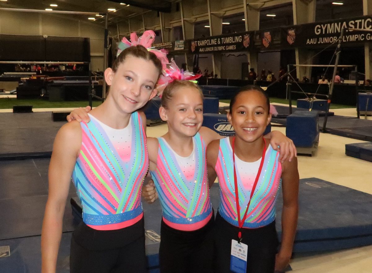 Three gymnasts from Lindbergh Schools pose for a photo at the Junior Olympics Games in Des Moines, Iowa. Photo courtesy of Kara Wiehage.