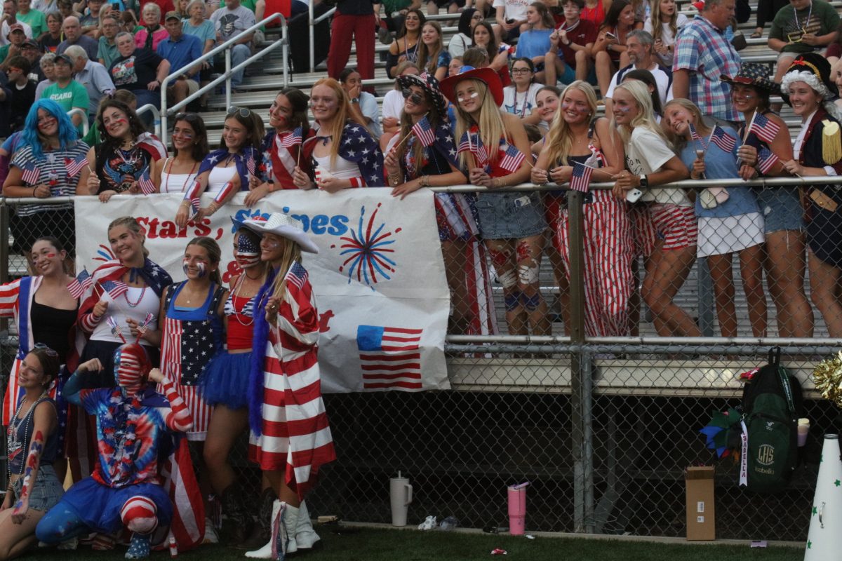 A patriotic group from Lindbergh's student section poses for a photo at the Flyers' first responders and military appreciation night, held Sept. 11.