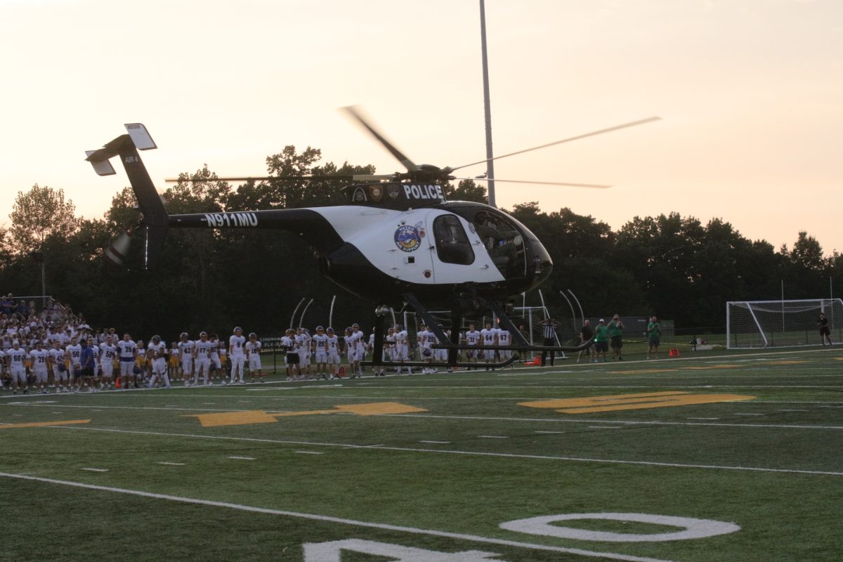 The Sept. 11 game ball arrived via a Metro Air Support helicopter, piloted by Zach Schmitt.