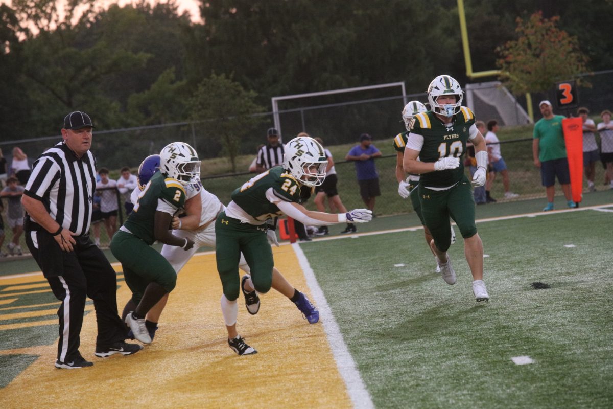 Following the first responders and military appreciation celebrations, the Flyers took the field against Seckman. Pictured above, Lindbergh's CJ Luczak (#24) lunges for the ball.