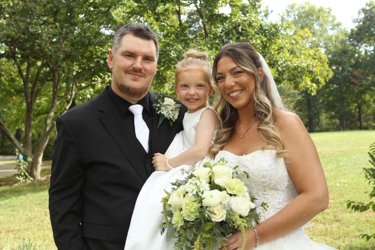 Robert “Bob” Capriglione and Sarah Reis, pictured on their wedding day with their daughter, Sophia.