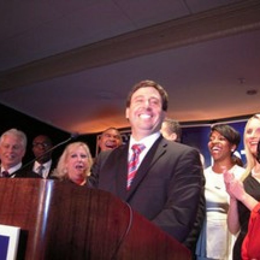 Sixth District Councilman Steve Stenger, D-Affton, promises his supporters at his victory party that he will restore their faith in county government. Pictured, front row, from left, are: 5th District Councilman Pat Dolan, D-Richmond Heights, who won re-election; Stengers sister Debbie Mourning; Stenger; Leslie Broadnax; Stengers wife Allison; and former Sen. Betty Thompson.