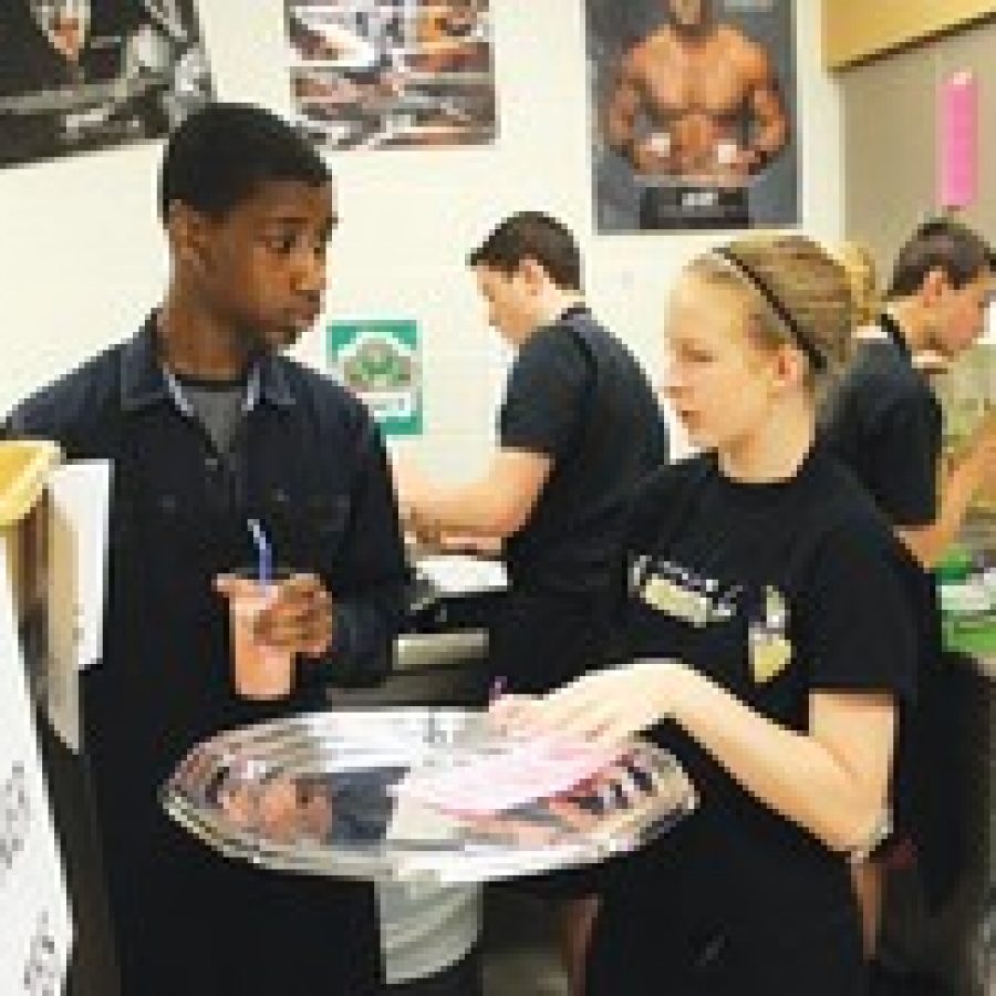 Bernard Middle School eighth-grade students learn to get through a late-morning brunch rush at the schools Career Activity Day Friday. 