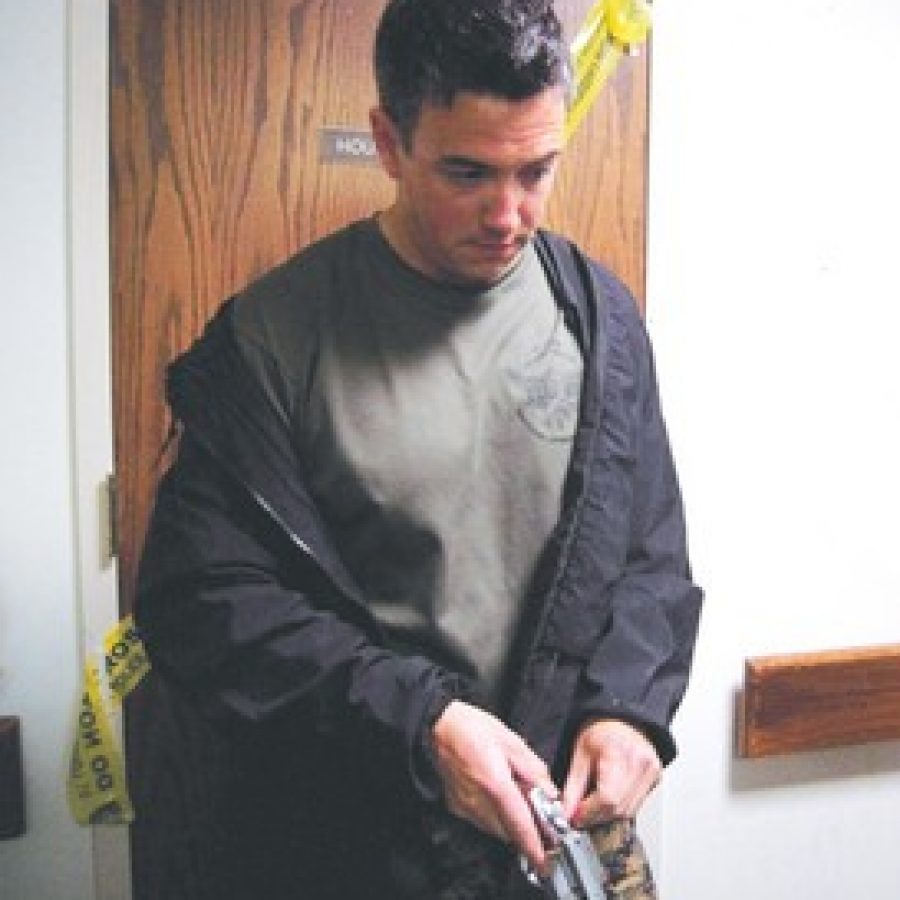 St. Louis County Police Officer Matthew Caravella portrays a gunman during the Police Departments Multi-Assault, Counter Terrorism Action Capabilities training at St. Anthonys Medical Centers Anthony House last week. 