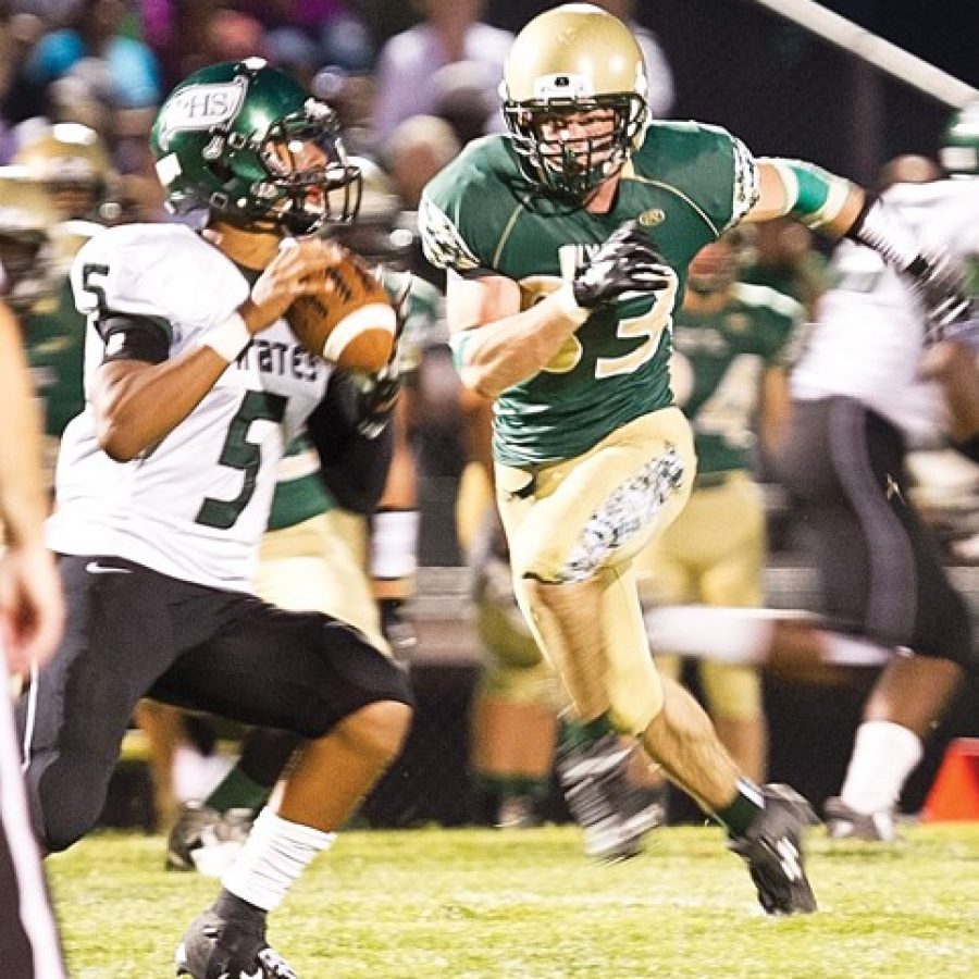 Lindberghs Doug Tate, No. 83, puts pressure on Pattonville quarterback Kaleb Eleby, No. 5, during Friday nights game.