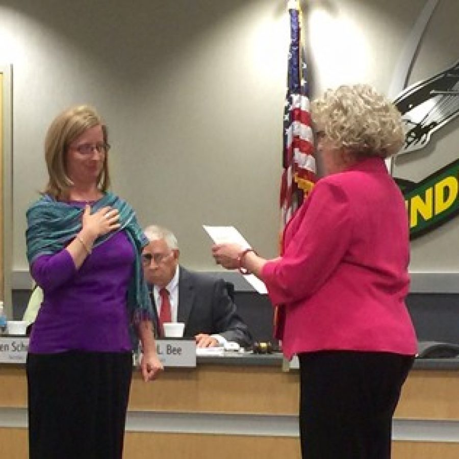 Lindbergh Board of Education President Kathleen Kienstra, second from right, swears in returning board members, from left, Kate Holloway and Secretary Karen Schuster, in April. Also pictured is Superintendent Jim Simpson, right, and Vice President Don Bee, middle.