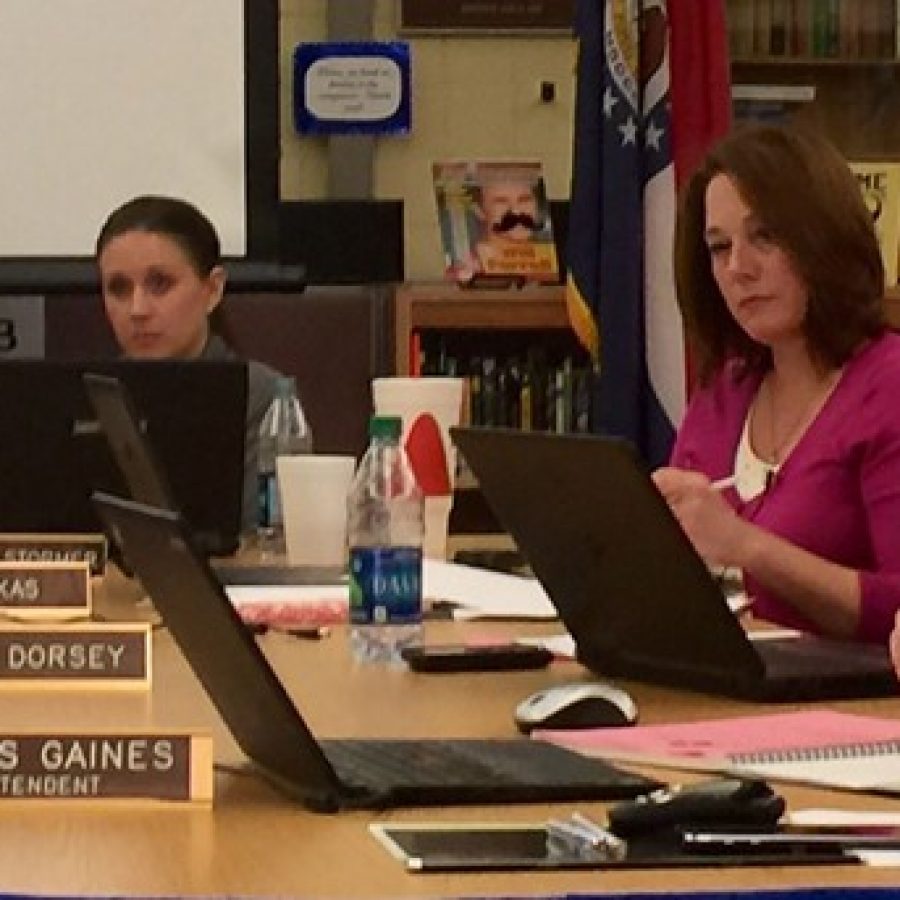 Board members listen as district parents call for Mehlville Board of Education member Lori Trakas to resign. Pictured from left, Secretary Samantha Stormer, Trakas and Lisa Dorsey.