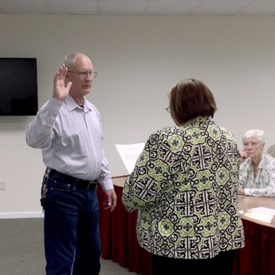 Green Park Ward 1 Alderman Michael Broughton, left, is sworn into office by City Clerk/City Administrator Zella Pope in April.