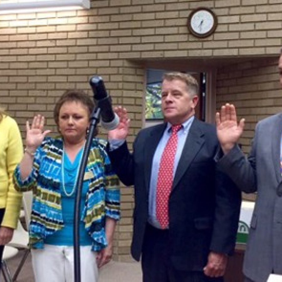 Returning Aldermen, from left, Pat Fribis of Ward 4 and Dee Baebler of Ward 1 and new Aldermen Keith Kostial of Ward 3 and Steve Bersche of Ward 2 are sworn in last week by Deputy City Clerk Carol Lay, far left.