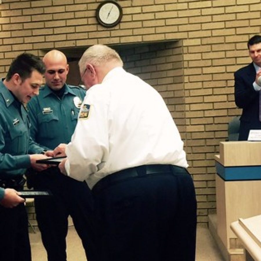 At the Dec. 8 Sunset Hills Board of Aldermen meeting, Cpl. Jeff Senior, center, Sgt. Steve Lucas, left, and Officer Lee Thompson are honored by the city and Police Chief William LaGrand for saving the life of an overdose victim. Looking on, from left, are Public Works Director Bryson Baker, Lt. Greg Zveitel and Deputy City Clerk Lori Stone.