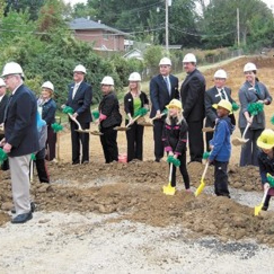 Lindbergh Schools students, administrators, Board of Education members and Missouri Board of Education Vice President Vic Lenz, right, join Ollie Dressel, left foreground, Friday morning in breaking ground for the new 650-student Dressel Elementary School. Mike Anthony photo