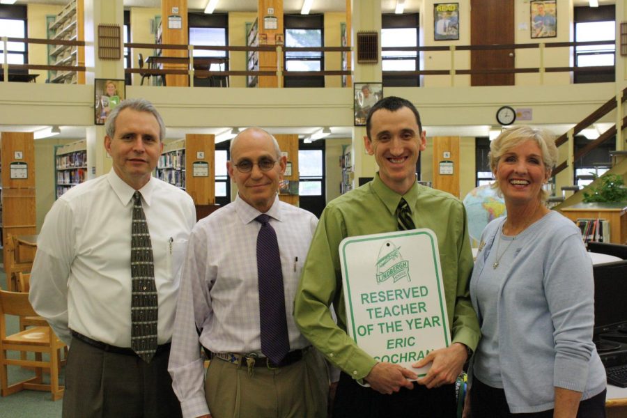 Lindbergh Schools 2011-12 Teacher of the Year Eric Cochran is congratulated by, from left, Superintendent Jim Simpson, Lindbergh High School Principal Ron Helms and 12th-grade Principal Pam Mason.