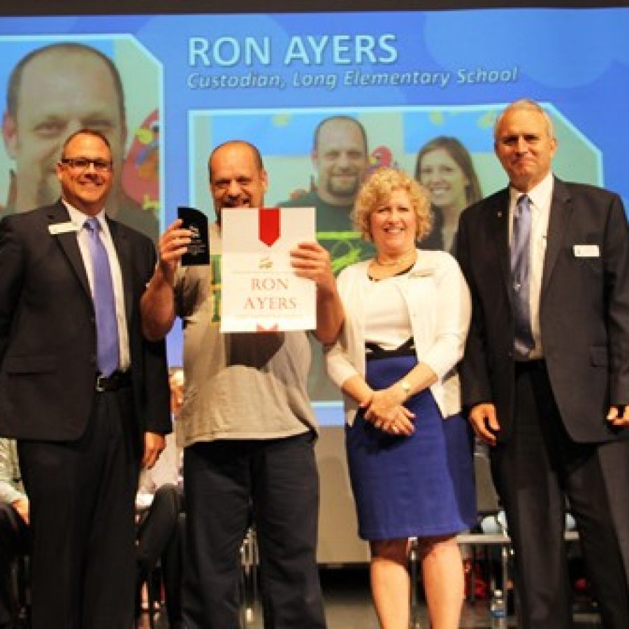 Long Elementary School lead custodian Ron Ayers is named the 2016 Lindbergh Schools Support Staff Person of the Year during the districts Staff Recognition Ceremony. At the ceremony, from left, are: Assistant Superintendent of Human Resources Brian McKenney, Ayers, Board of Education President Kathy Kienstra and Superintendent Jim Simpson.