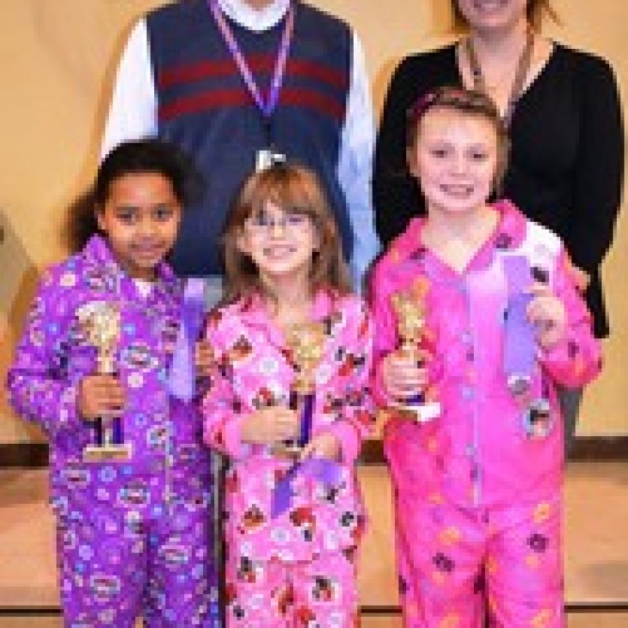 Gotsch Intermediate School Principal, Brian Smith, and Laura Pezzani, gifted and talented teacher, with third-grade spelling bee winners from left to right Helen Shannon, 1st place, Ela Potera, 2nd place, and Claire Burmester, 3rd place. 