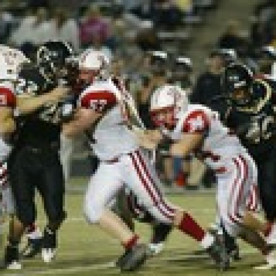 Oakvilles Moe LaGrand, No. 20, runs roughshod over the Fox Warriors. LaGrand, a two-way starter, rushed for 184 yards with three touchdowns in the Tigers 27-0 win over Fox Friday night.