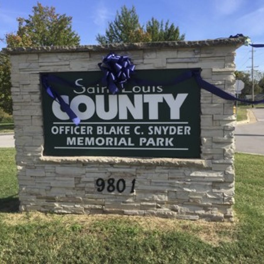 Signs for the new Officer Blake C. Snyder Memorial Park were installed at the former Clydesdale Park Thursday, after the park was renamed Tuesday night by County Executive Steve Stenger. Gloria Lloyd photo