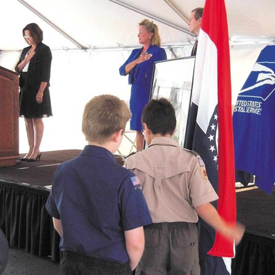 Members of Boy Scout Troop 627 post the colors last week during the ceremony renaming the Sappington Post Office in honor of Army Lt. Daniel Riordan. Pictured on the stage, from left, are: St. Louis Postmaster Cathy Vaughn, U.S. Rep. Ann Wagner and Postal Service Gateway District Manager Charles Miller.