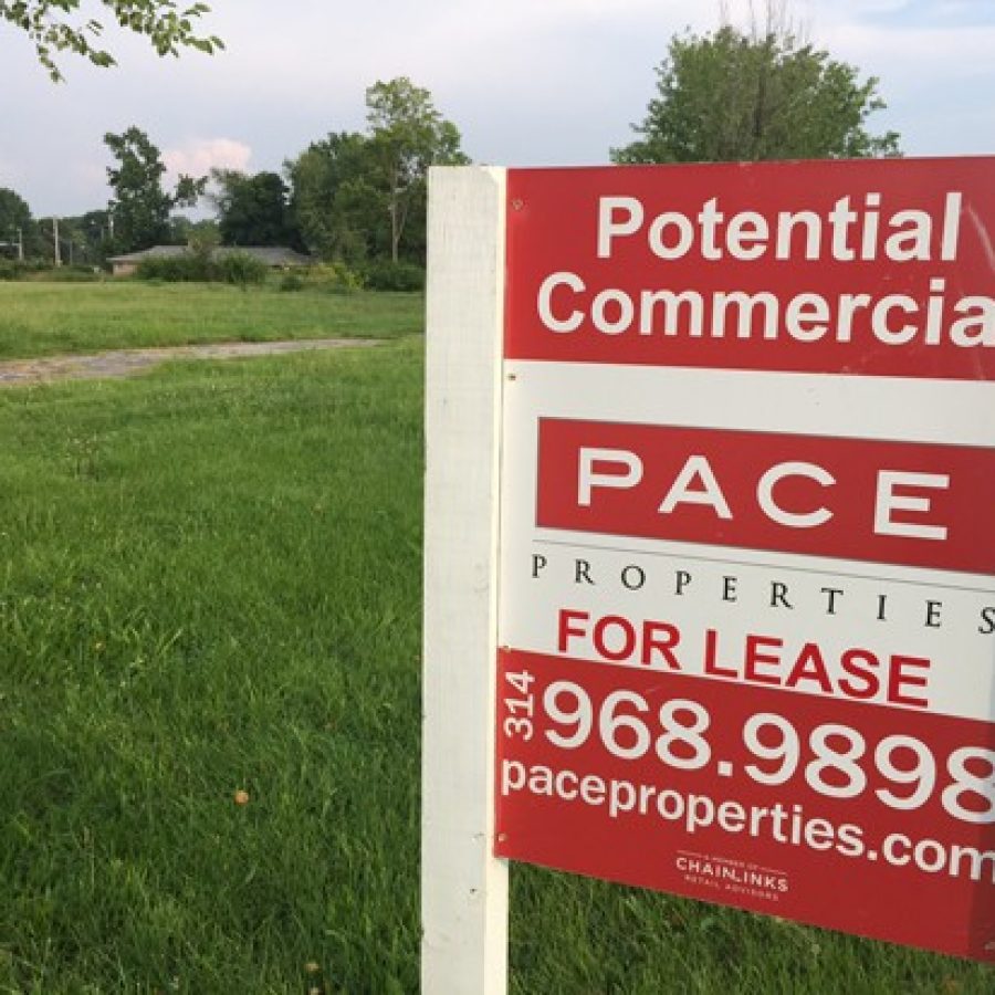 Potential commercial signs from Pace Properties went up on the tornado-damaged Court Drive area last summer.