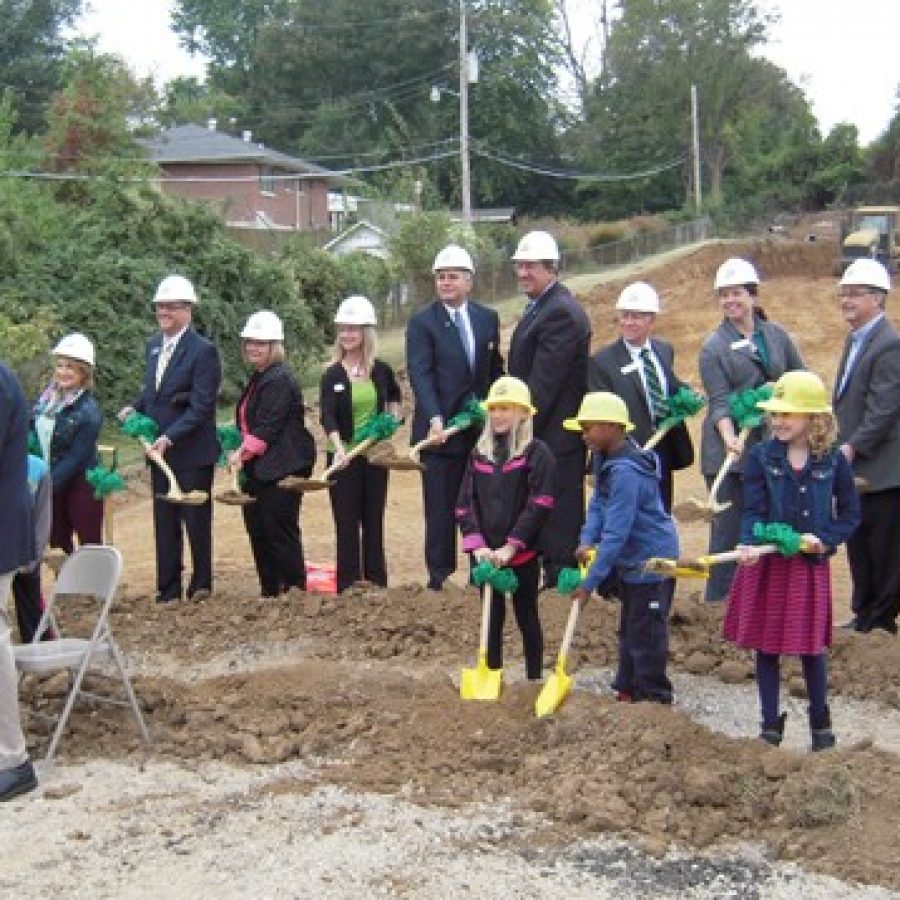 Lindbergh Schools students, administrators, Board of Education members and Missouri Board of Education Vice President Vic Lenz, right, join Ollie Dressel, left foreground, last October to break ground for the new 650-student Dressel Elementary School.